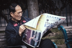 Man Reading Newspaper in Portsmouth Square
